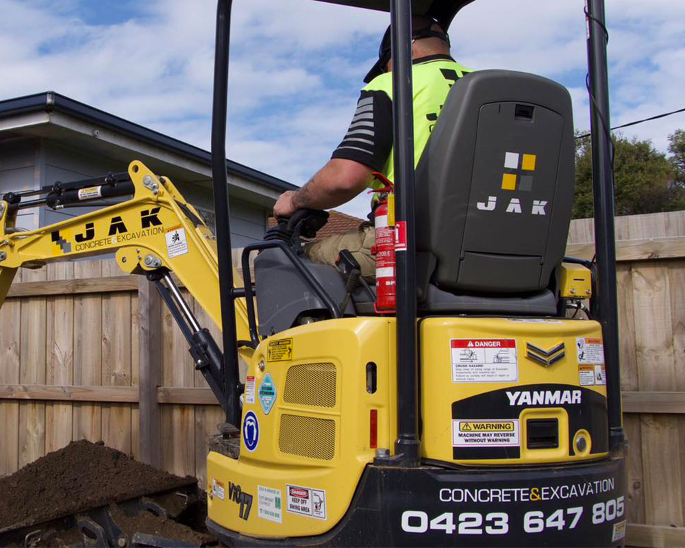 JAK operator on a mini excavator